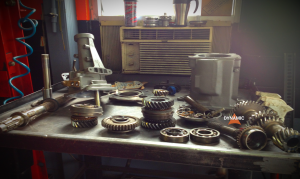 Various Transmission parts placed out on a table to show you what parts are inside a transmission